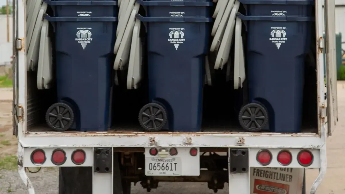 New Kansas City trash carts on a truck.