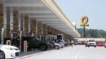 Cars and trucks fuel up at a massive Buc-ee's gas station and convenience store.