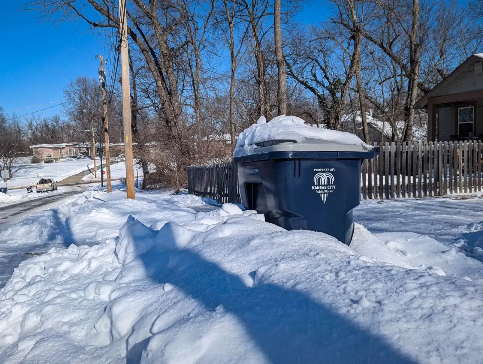 Trash pickup is, well, picking up around the region up after delays caused by recent snow storms. (Luke X. Martin | KCUR 89.3)