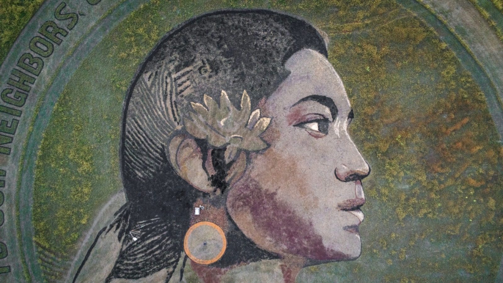 Lawrence, Kansas-based crop artist, Stan Herd, says his portrait of a Mexican indigenous woman is the most relevant work he has created. The portrait in a field in Linwood, Kansas. (Mary Sanchez | Flatland)