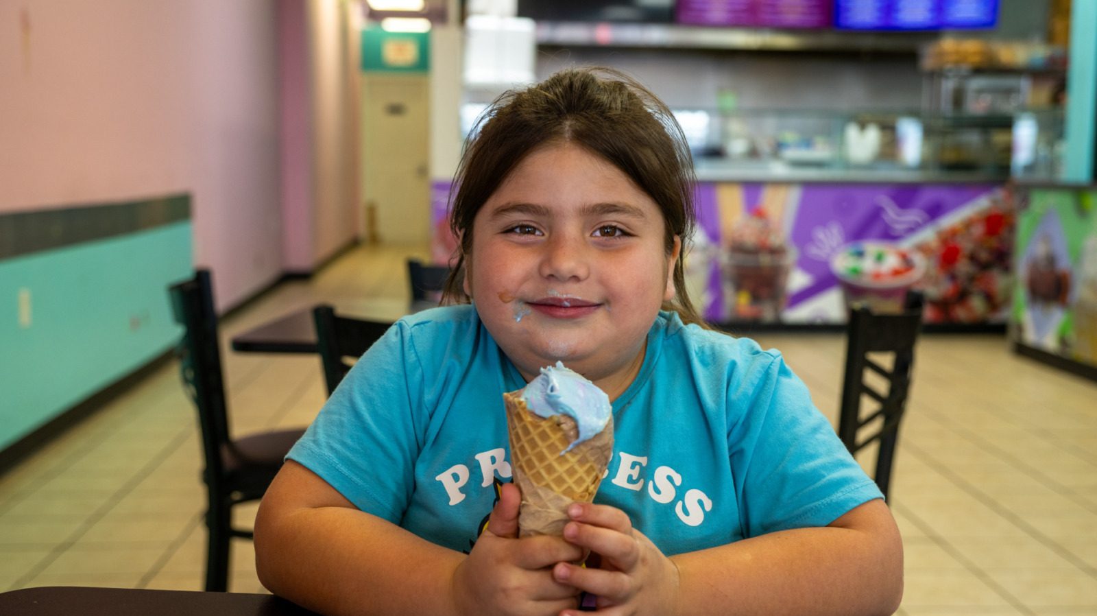 Yazmine Guerrero, 7, of St. Joseph, Missouri, enjoyed a bubblegum ice cream waffle cone recently at Frutopia, located at 3737 Independence Avenue in Kansas City, Missouri. Frutopia is a Mexican paleteria, ice cream shop, and grill. (Todd Feeback | Flatland)