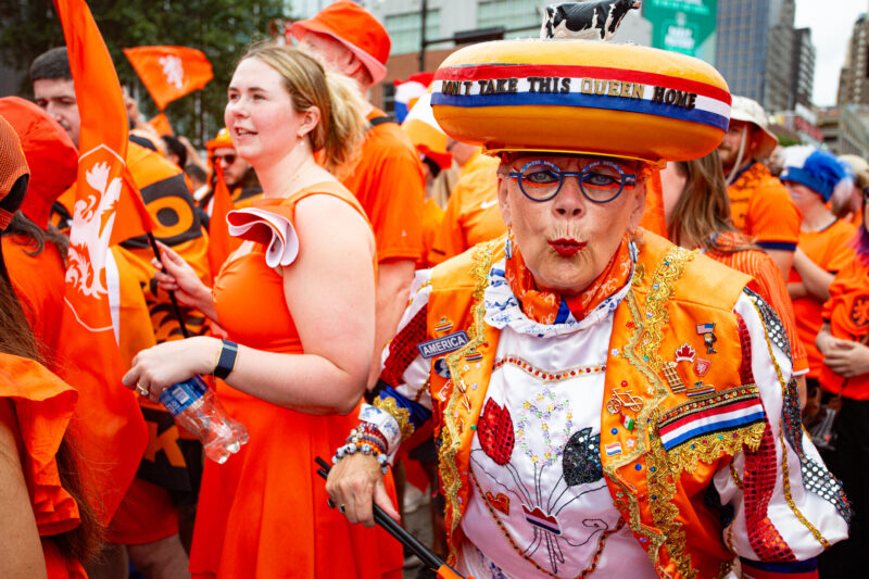 A reveler participates in the famed Netherlands fan walk on June 25, 2026, in Downtown Kansas City. (Vaughn Wheat | The Beacon)