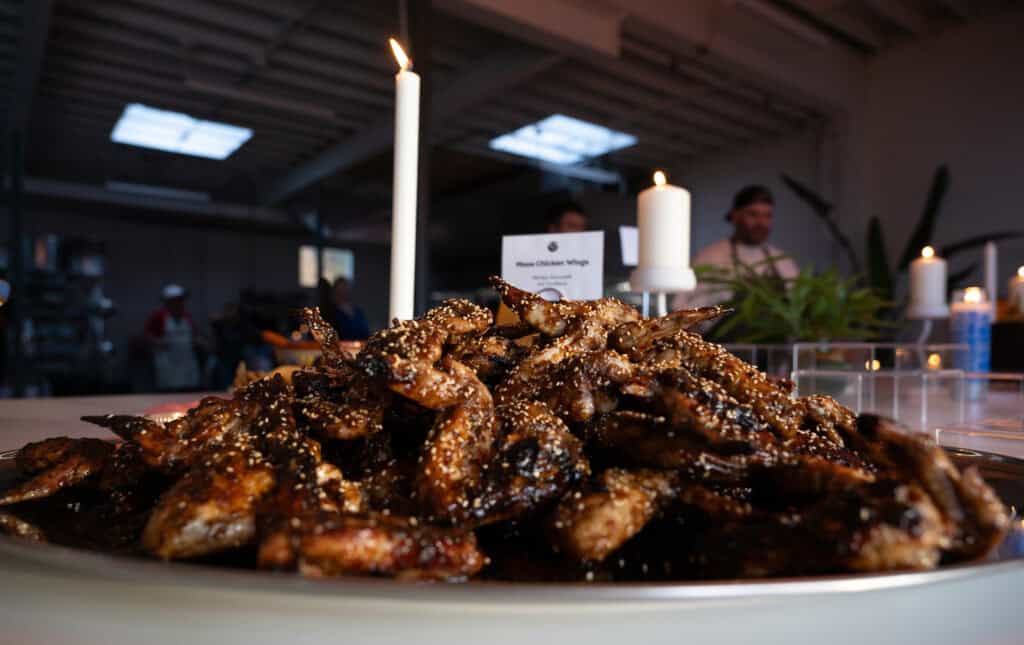 A plate of Masa Shio Koji wings for an Anti-ICE Supper Club event waited for guests at Yoli Cocina, in Kansas City, Mo. on Tuesday, Oct. 13, 2026.