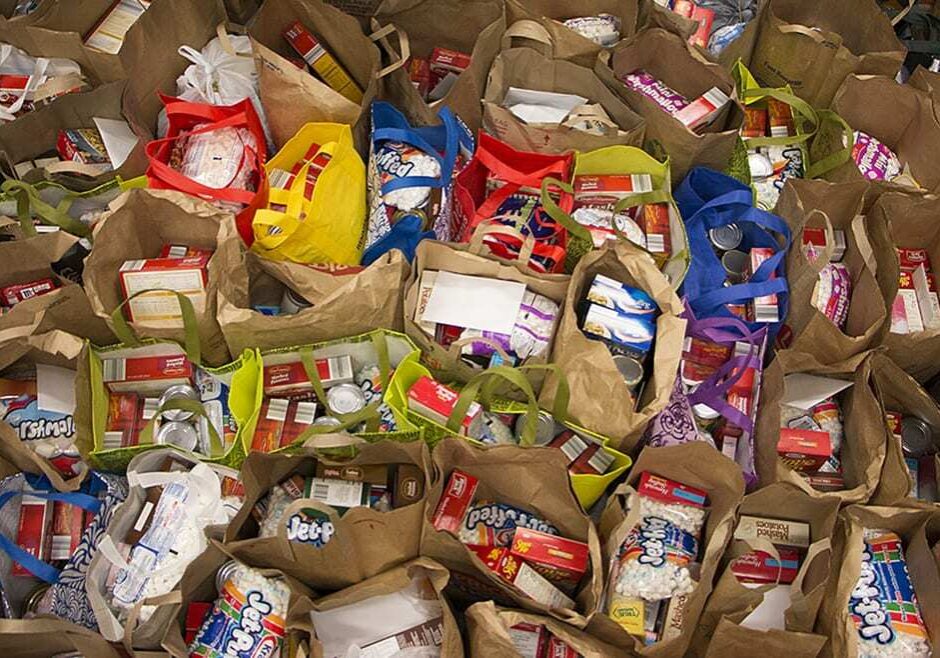 Holiday meals with ‘everything including the marshmellows’ stood ready for distribution Monday afternoon at City Union Mission in Kansas City, Mo. Dennis Chapman, chief development officer for City Union Mission, said they will distribute over 550 meals to needy families in the area.