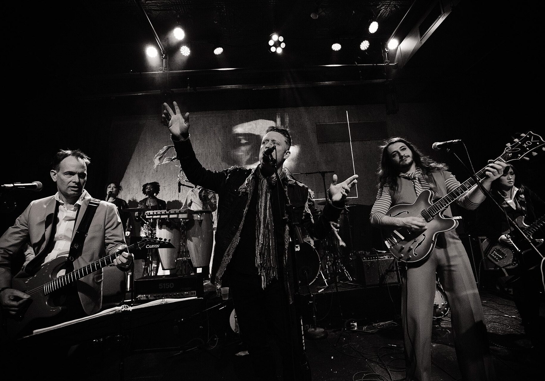 The Band That Fell to Earth plays music on stage.