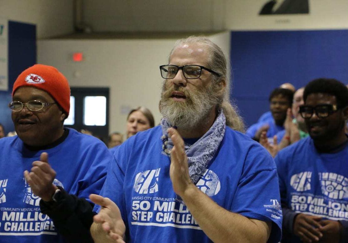man cheers with team