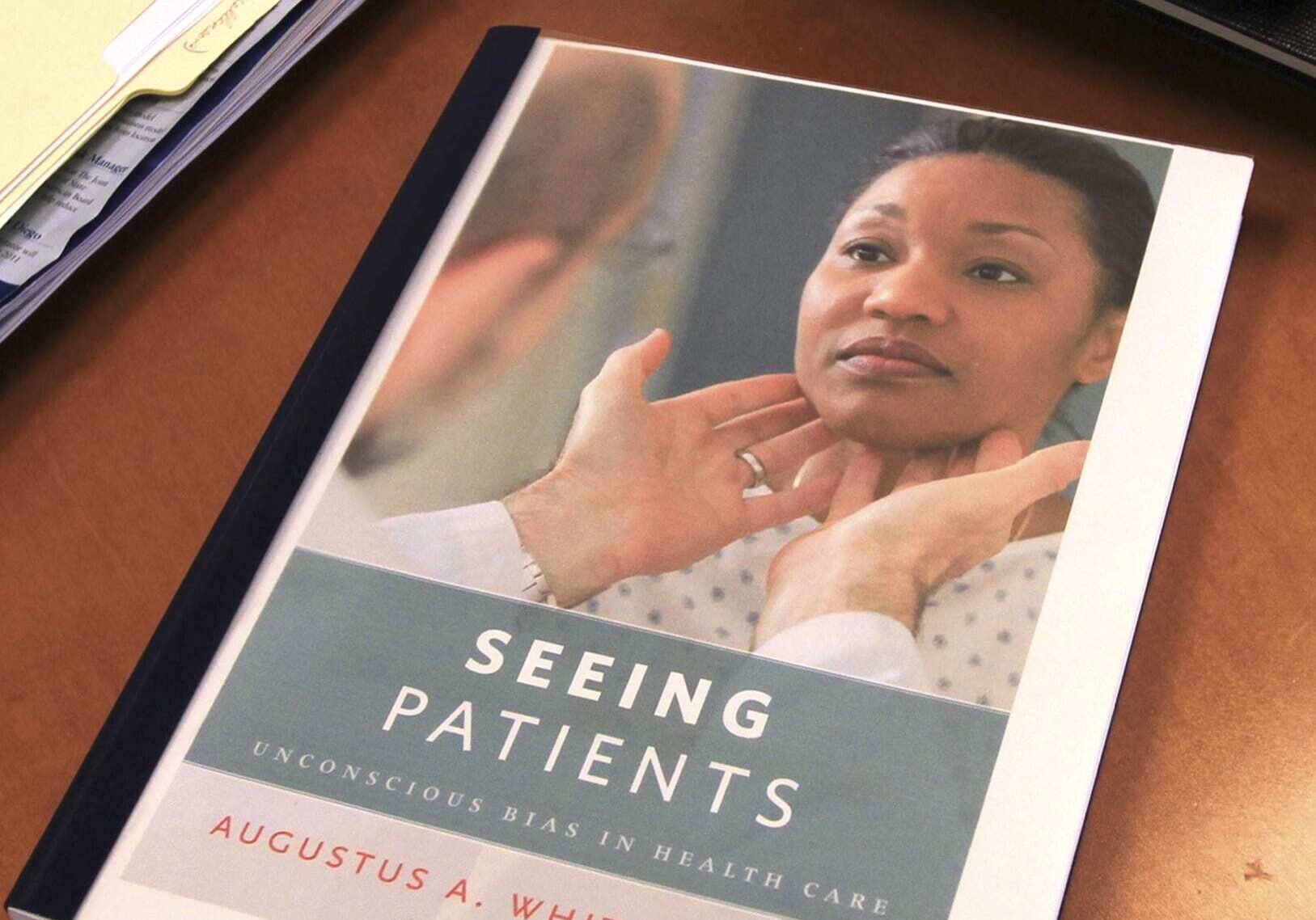 In this Dec. 21, 2010 photo, a proof copy of the book, "Seeing Patients," rests on Harvard Medical School professor Augustus White's desk in Boston. White's memoir calls for more diversity in the medical field and an end to health care disparities. (AP Photo/Chitose Suzuki)