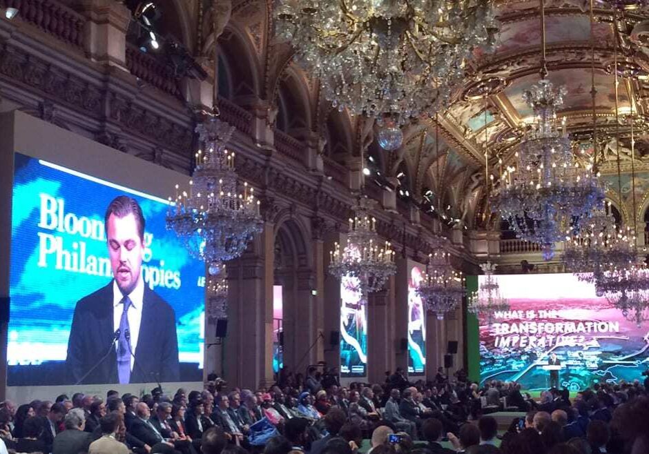 US actor Leonardo DiCaprio is seen on a giant screen during a meeting with Mayors to push for local actions and fight climate change during COP21, United Nations Climate Change Conference in Paris, France. (Photo: Catherine Gaschka | AP)