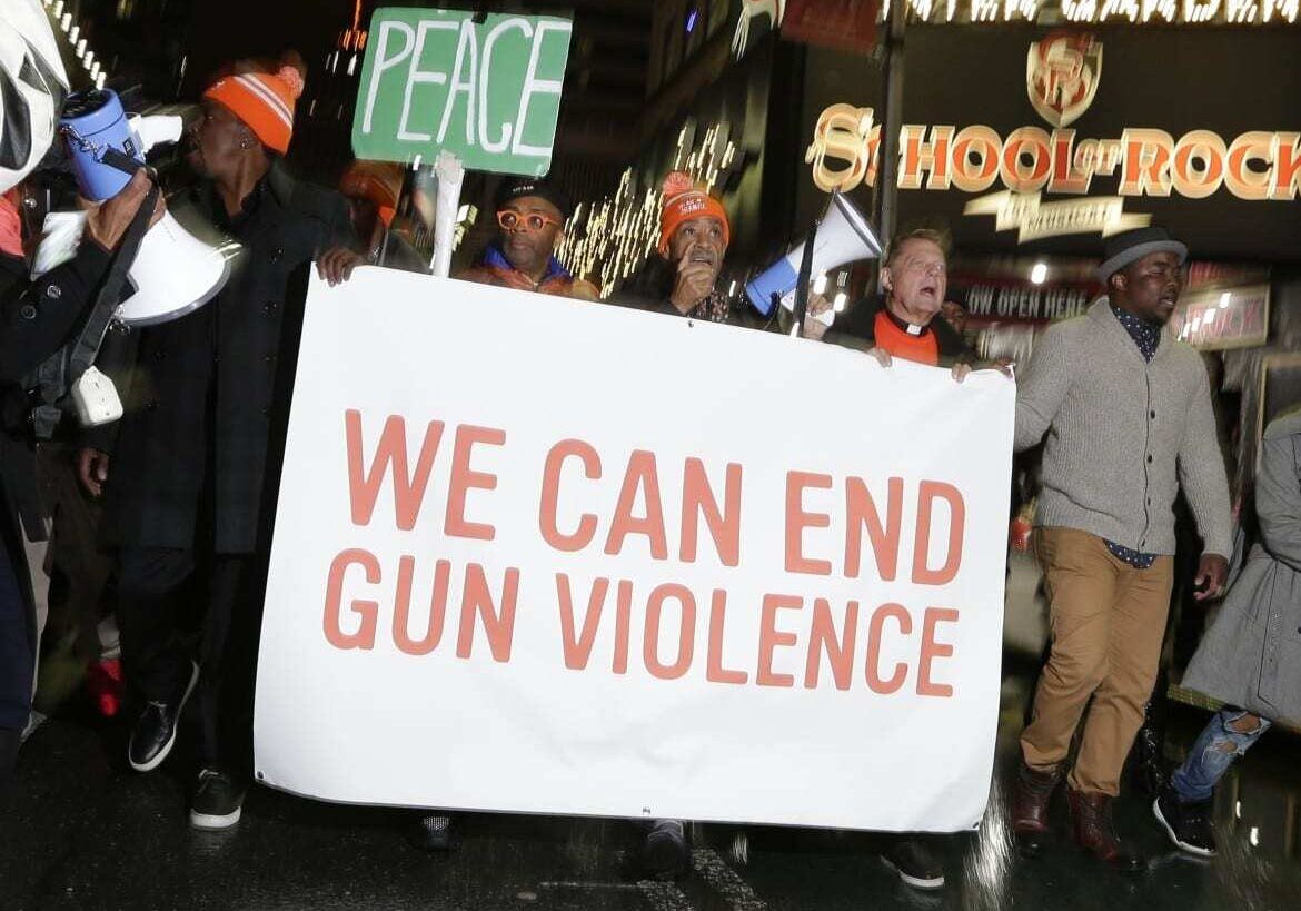 Spike Lee, The Rev. Al Sharpton and actors from the movie "Chi-Raq" lead an anti-gun violence protest in New York City. The movie is co-written by Kevin WIllmott, a film professor at KU. (Photo: Associated Press) 