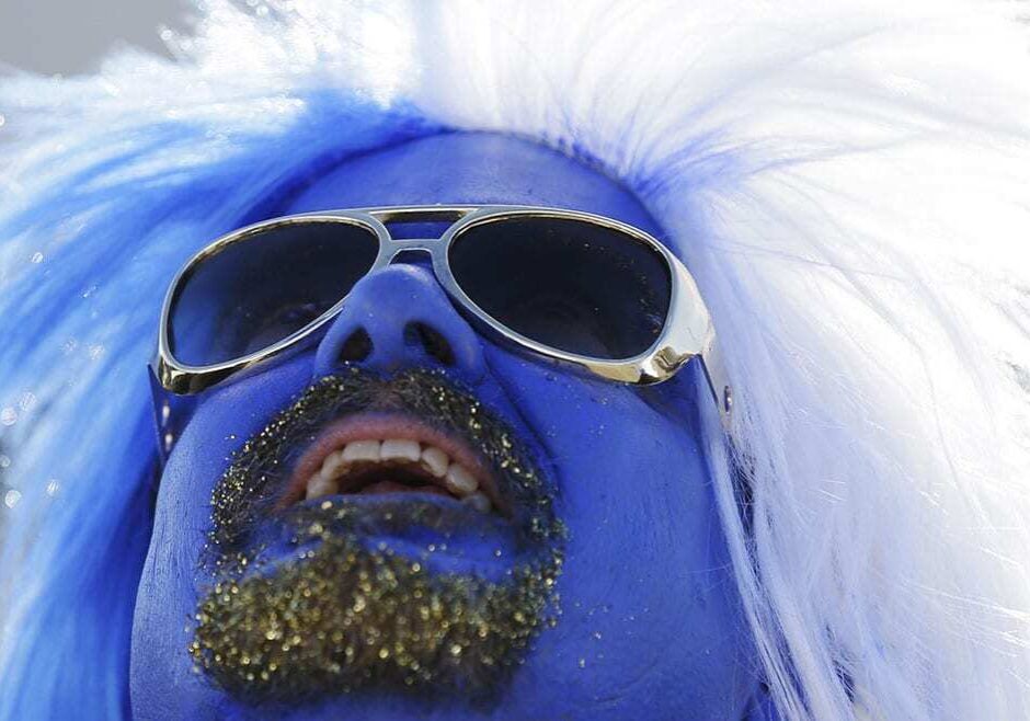 Ben Goldberg, from Kansas City, looks up at Kauffman Stadium before Game 1 of baseball's World Series between the Kansas City Royals and the San Francisco Giants Tuesday, Oct. 21, 2014, in Kansas City, Mo. (AP Photo/Charlie Neibergall)