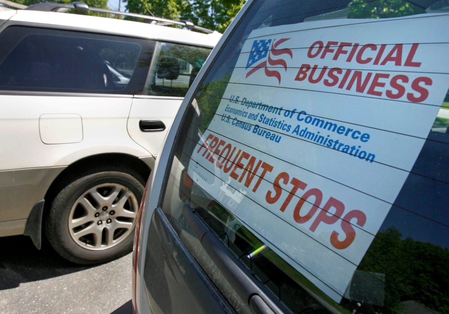 A sign marks the vehicle of a census enumerator.
