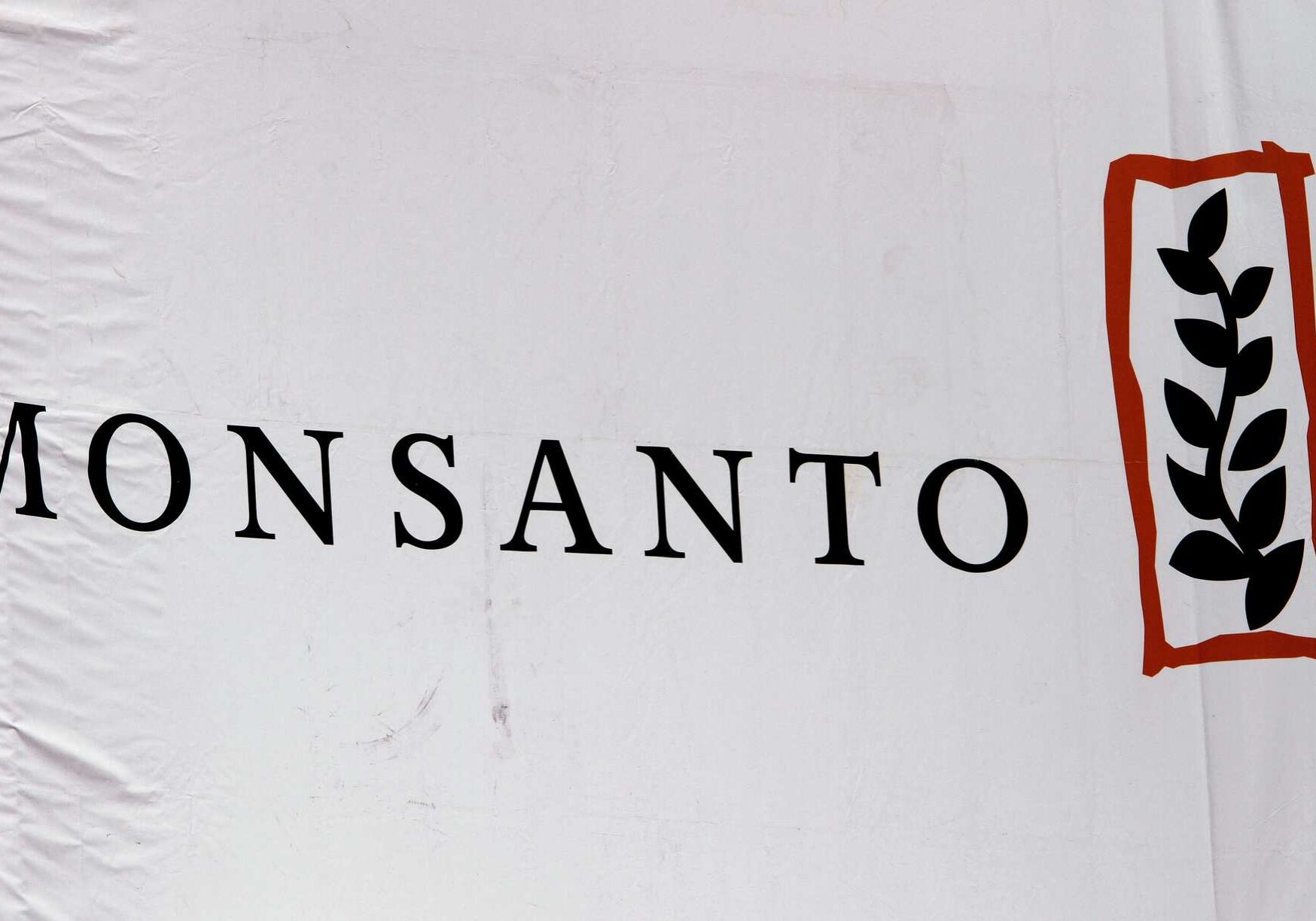 FILE - This Aug. 31, 2011 file photo shows the Monsanto corporate logo at their exhibit booth during the Farm Progress Show, in Decatur, Ill. Marches and rallies against seed giant Monsanto are getting under way across the U.S. and in dozens of foreign countries Saturday, May 25, 2013. March Against Monsanto protesters say they want to call attention to the dangers posed by genetically modified food and the food giants that produce it. Marches are planned in more than 250 cities around the globe, according to organizers. (AP Photo/Seth Perlman, File)