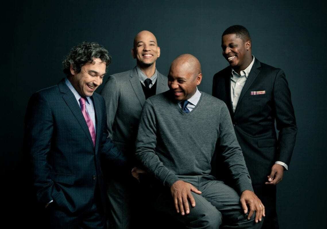 Four men who are in a quartet.
