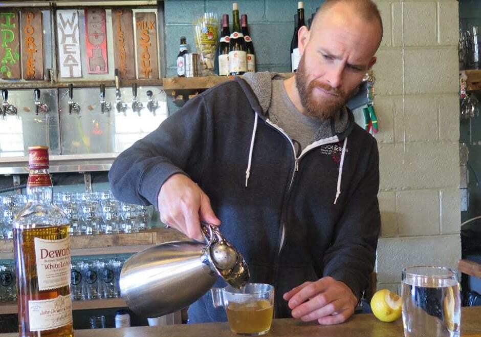 Bartender Sam Shepard serves a hot worty