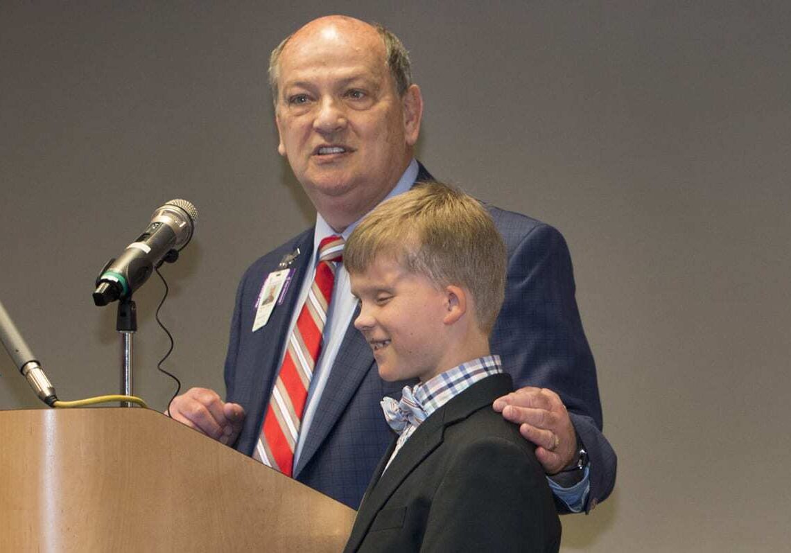 Children's Mercy CEO with former patient Charlie Walsh