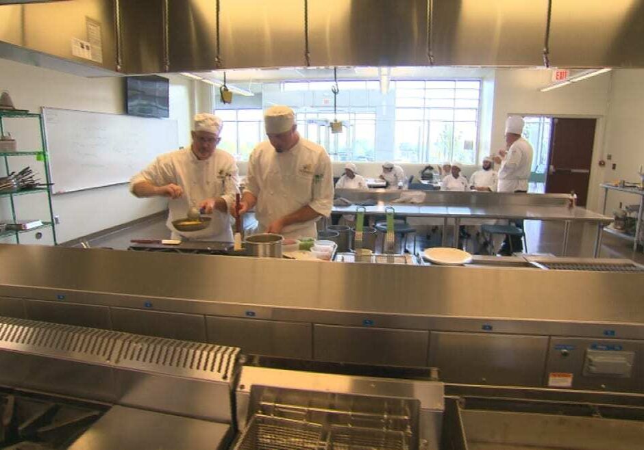 Two student chefs working in the JCCC Culinary Institute