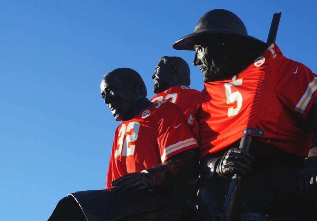 A statue dressed in Chiefs shirts.