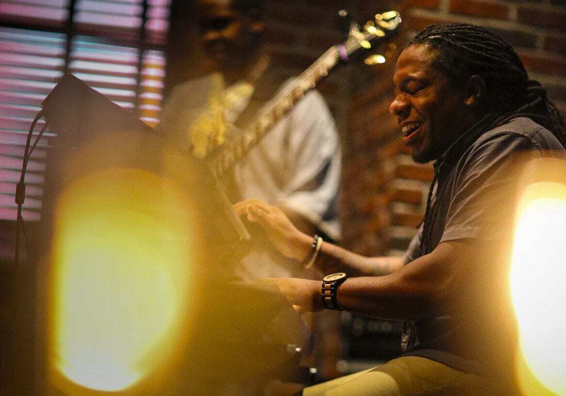 A man playing in a band.