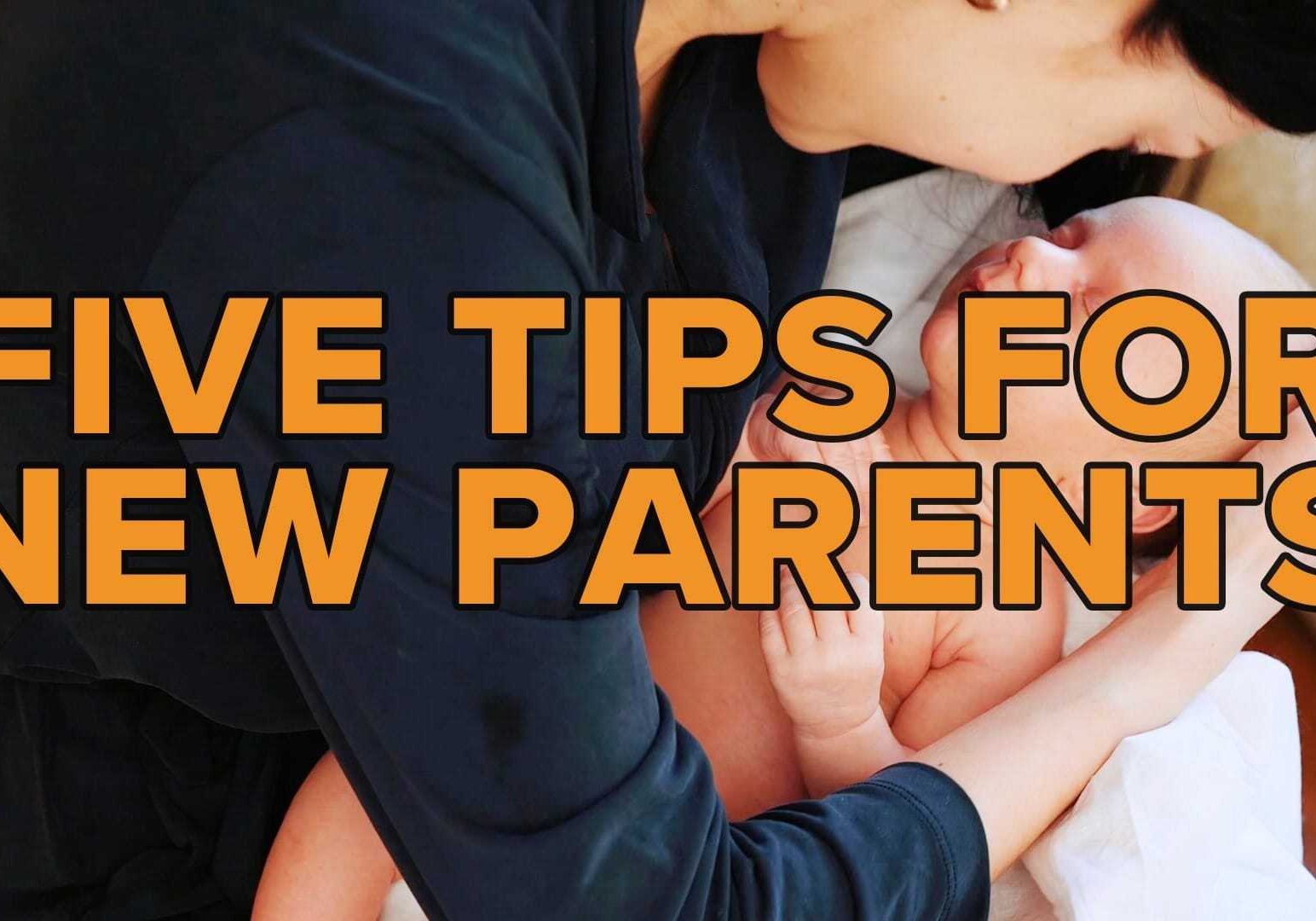 A parent holds a baby.