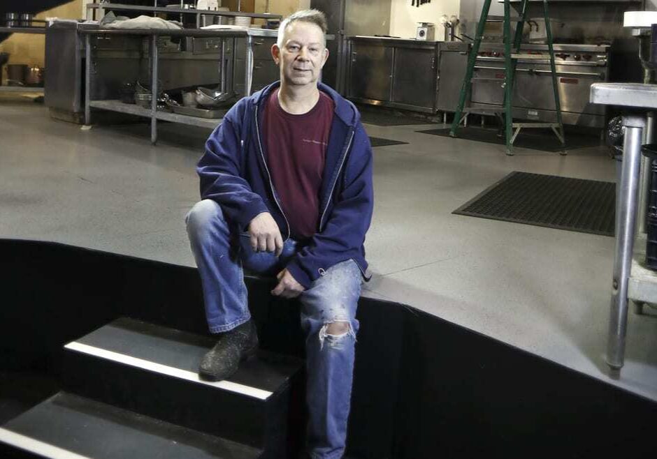 A scenic designer on stage