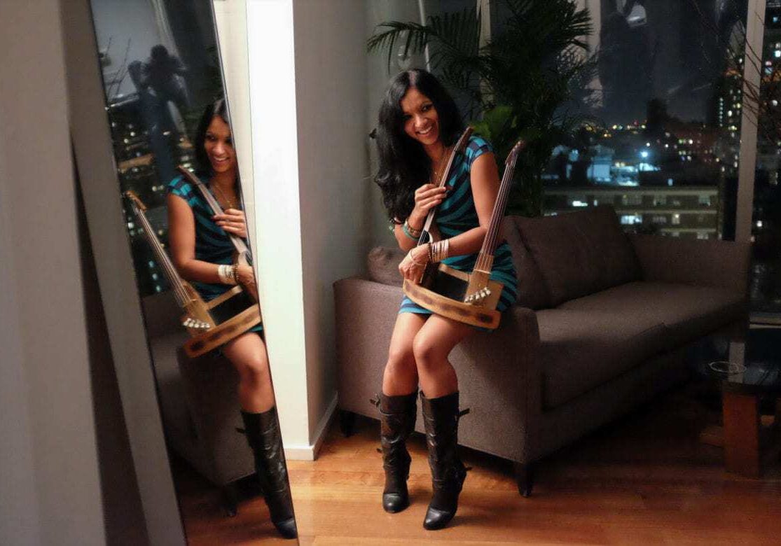A woman with a 10-string double violin.