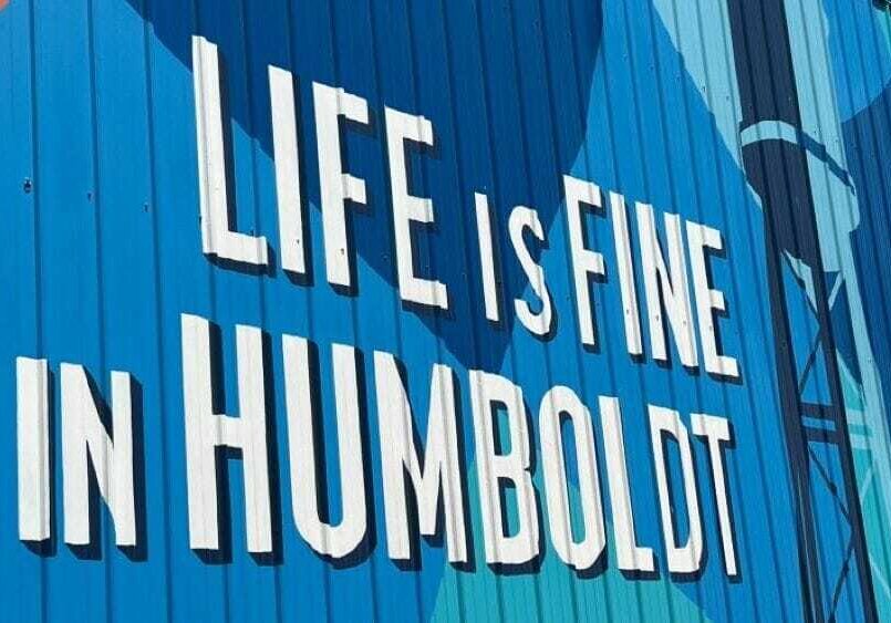 A sign on the side of a building reads "Life is Fine in Humboldt."