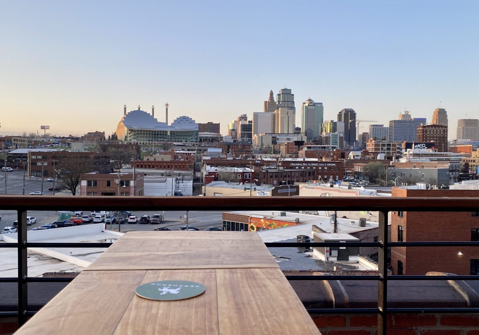 The north-facing view of the downtown skyline from Percheron on top of the Crossroads Hotel.