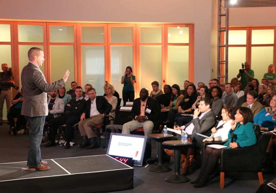 In a very "Shark Tank" like format, entrepreneur Chris Costello answers questions about his company Blooom from judges Marcelo Claure, Nicole Glaros and Miriam Rivera (center right)  at the 1 Million Cups finals Wednesday. Blooom would go on to win the event. (Photo: Daniel Boothe | Flatland) 