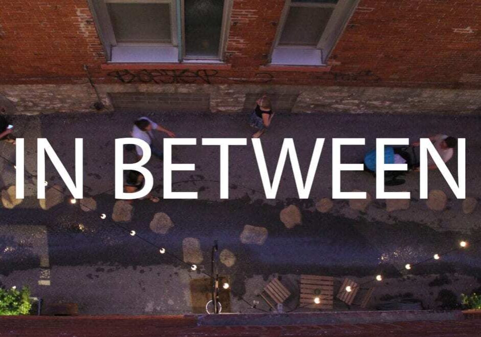 Image of an alley with words In Between written on it