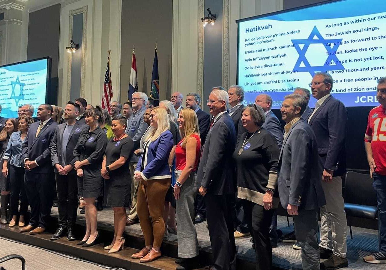Local elected and civic officials stood for photos at the conclusion of an update on Israel held in the boardroom of the Greater Kansas City Chamber of Commerce.