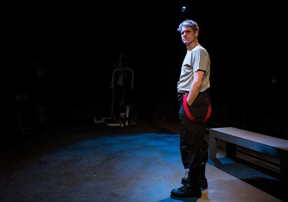 Actor Tim Ahlenius spoke from the perspective of working firefighters, in the production of Justice in the Embers, Feb. 4-20, 2016. (Photo: Brian Paulette | The Living Room Theatre)