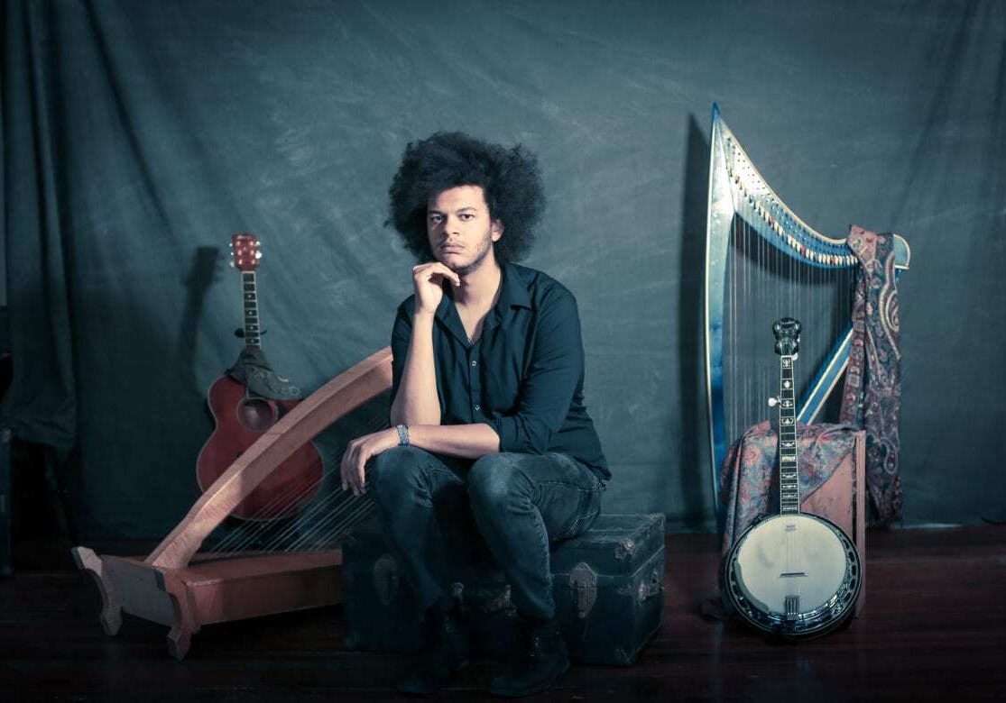 A musician sits.