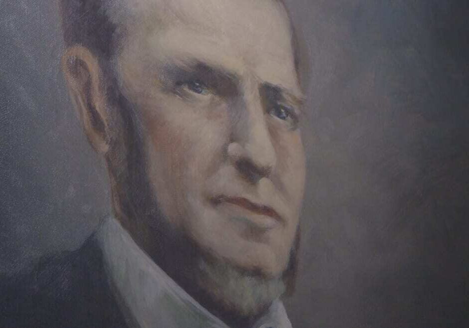 Close up picture of 1800s portrait of a man.