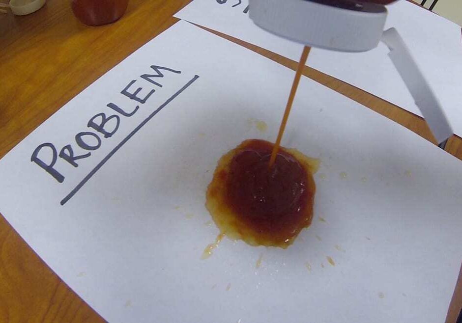 Photo of ketchup bottle squirting.