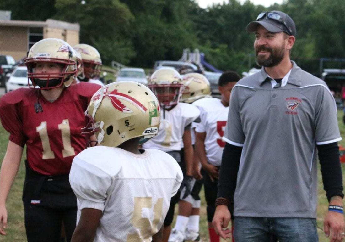 Nick Sanford with his youth football players