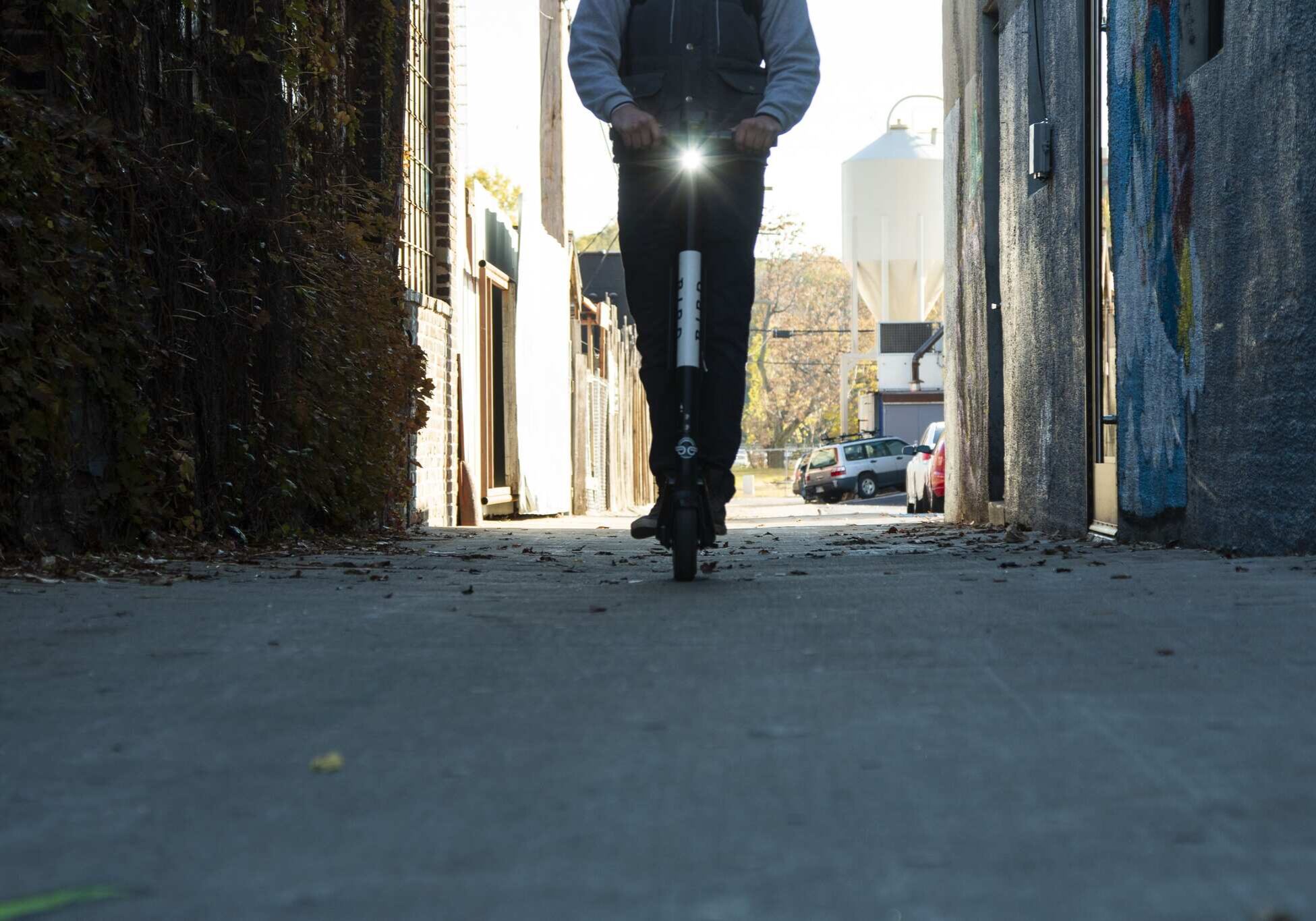 man riding a Bird scooter