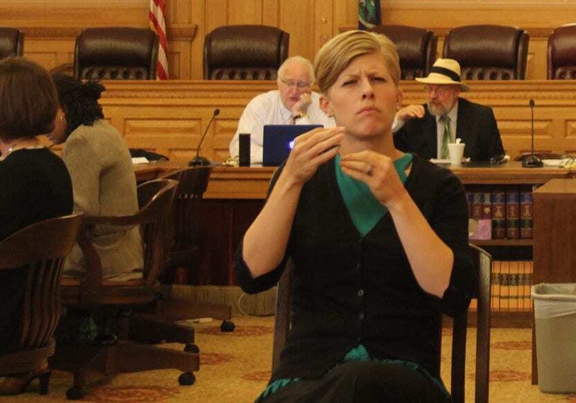 An American Sign Language (ASL) interpreter was available at the National Council on Disability forum last month in Topeka. Some advocates for deaf Kansans requested expanded Medicaid coverage for ASL therapy and training. (Andy Marso | Heartland Health Monitor)