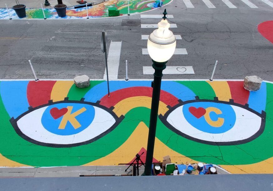 Aerial view of the “Eye Heart KC” mural by recent Kansas City Art Institute alumni Parker Story, at the intersection of Westport Road and Wyandotte Street, created as part of the first round of commissions under the Asphalt Art Initiative program.