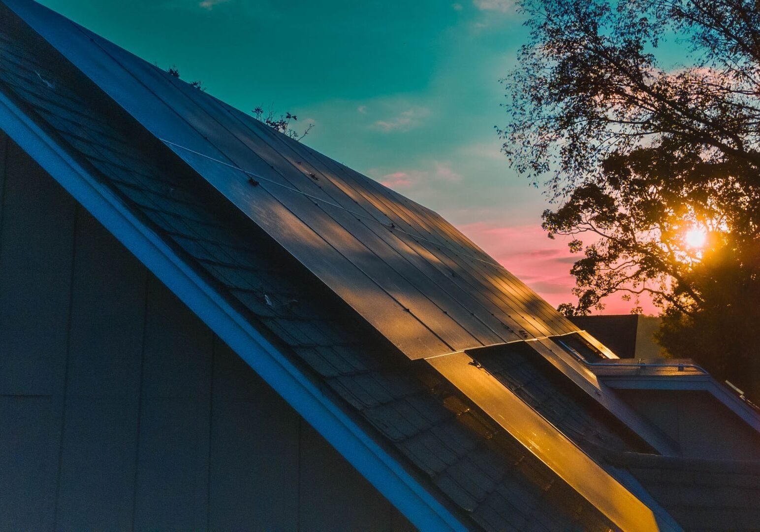 The morning light reflects off rooftop solar panels in the Lakewood subdivision.