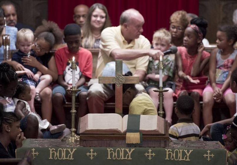 Youngsters gathered Sunday in the front of Covenant Presbyterian Church in Kansas City for a lesson from the pastor, the Rev. Kirk Perucca. The Time With Our Children segment comes in the middle of the church’s worship service. Photo by Shane Keyser