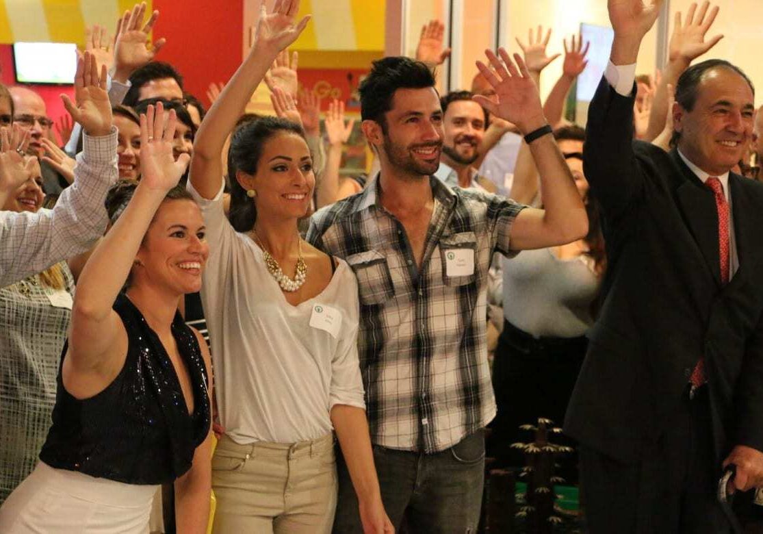 crowd raised their hands for kids at event