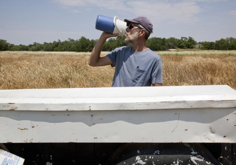 A man in Kansas takes a drink from a water container. While about 96 percent of Kansans receive water from public water supplies that meet or exceed all state and federal regulations for clean water, some public water systems have one of more sources that exceed safe levels of contaminants.