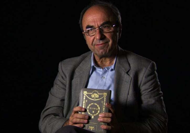 Rexhep Hoxha from 'Besa: The Promise.' holding Hebrew prayerbook