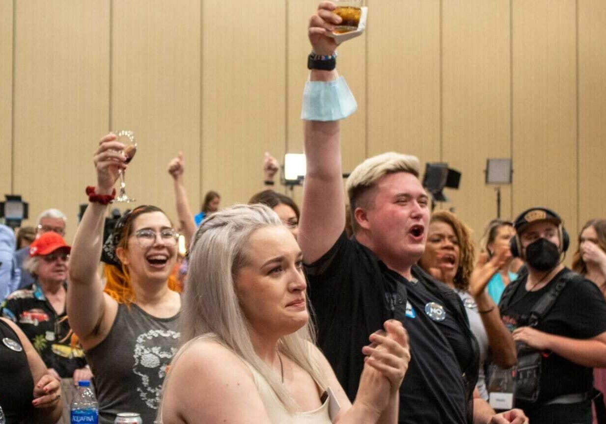 Attendees of the Kansans for Constitutional Freedom watch party celebrate after primary election results verify Kansans voted to keep abortion a constitutional right.