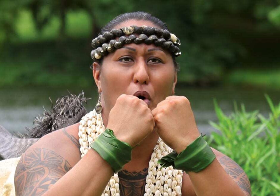 Photo of woman in traditional hula dress.