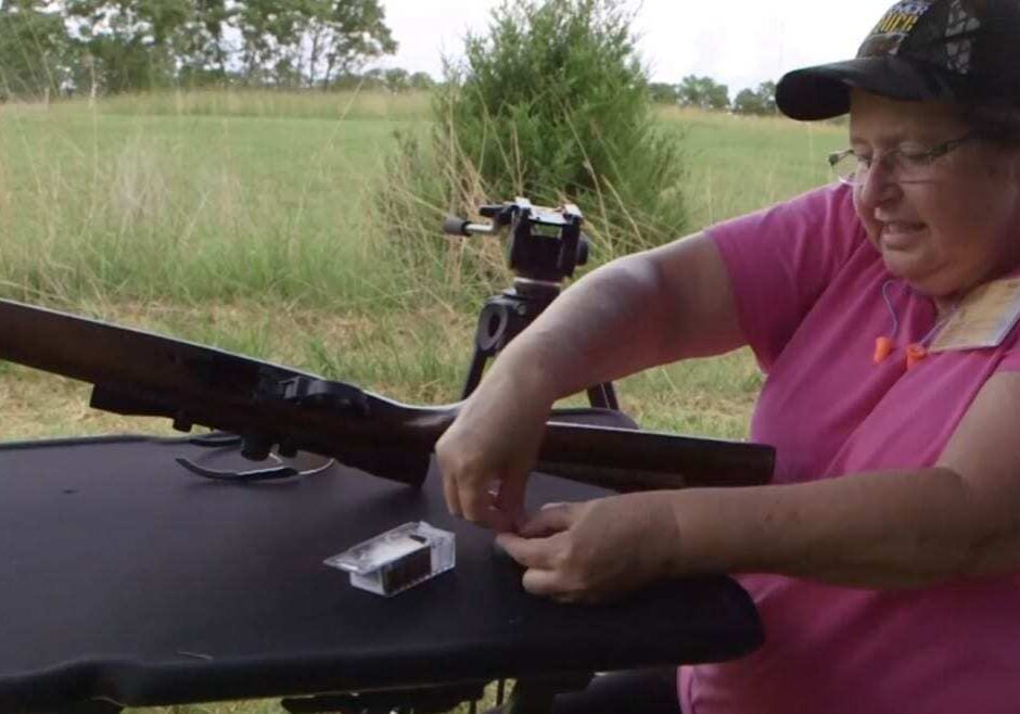 Scene from MDC camp video - woman shooting