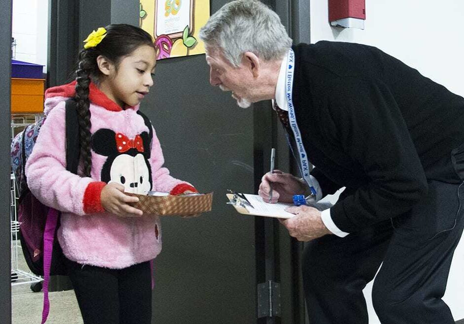 paul preston greeting a student