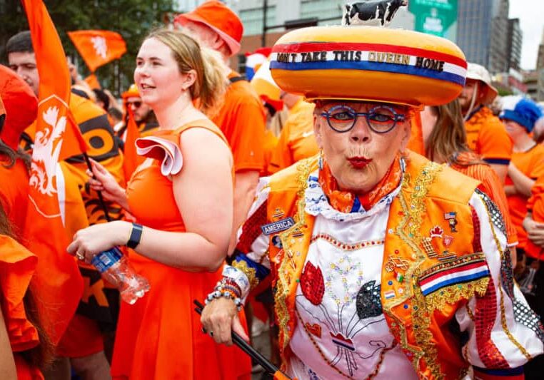 A reveler participates in the famed Netherlands fan walk on June 25, 2026, in Downtown Kansas City. (Vaughn Wheat | The Beacon)