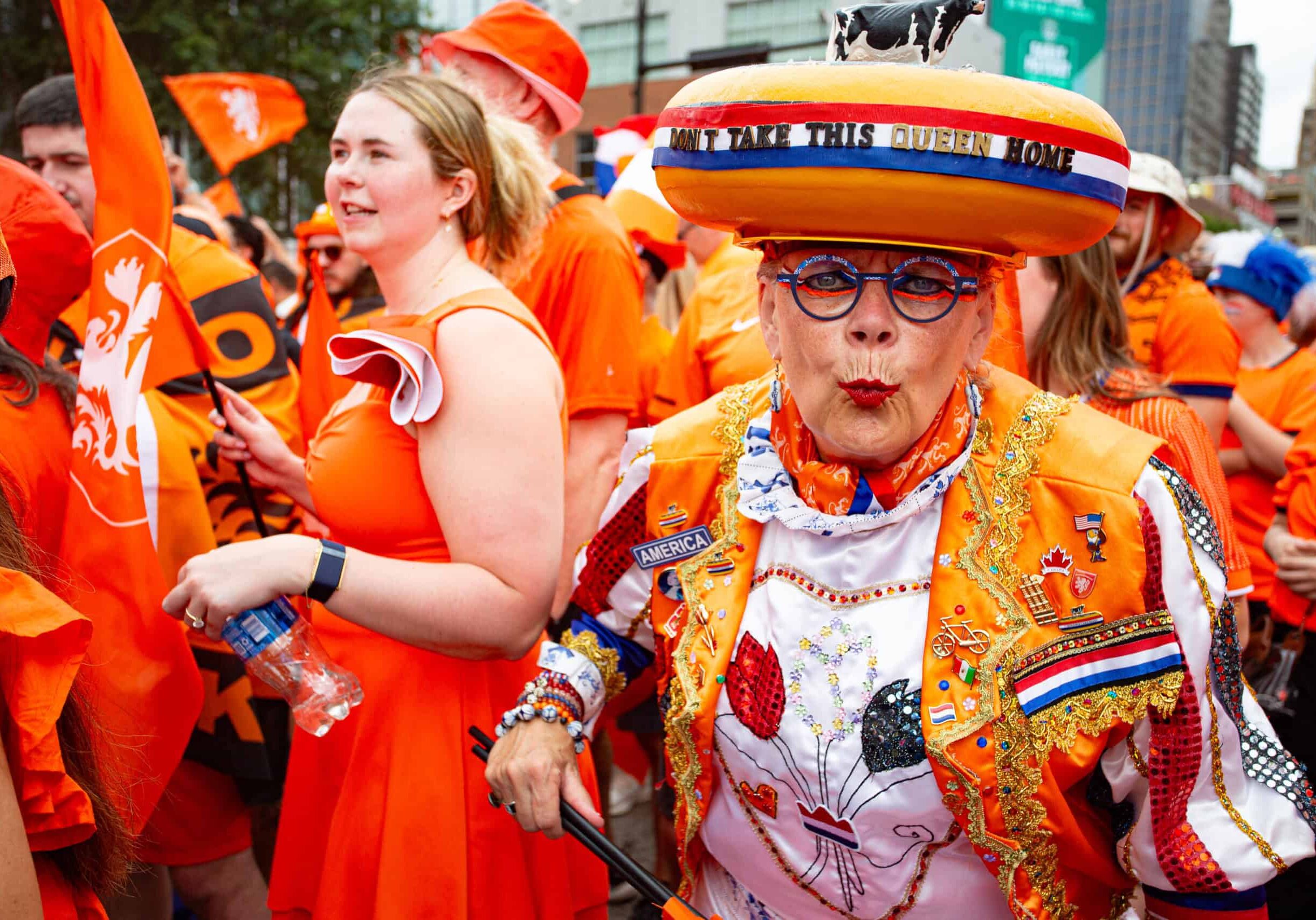 A reveler participates in the famed Netherlands fan walk on June 25, 2026, in Downtown Kansas City. (Vaughn Wheat | The Beacon)