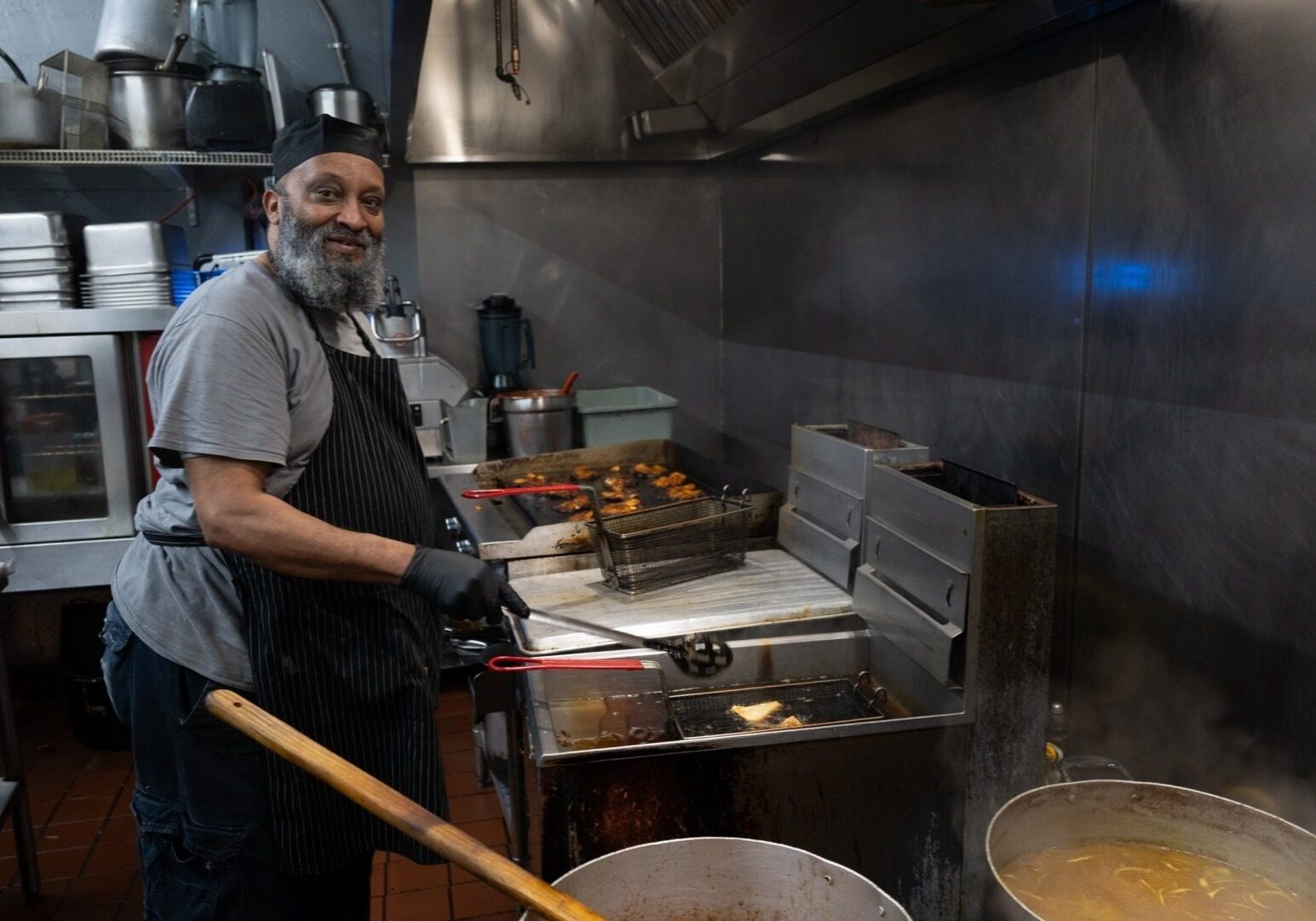 Chef/owner Abdul Hatimi of Yasmeen Cafe, located at 1447 Independence Ave., works in his kitchen recently for the lunch hour. (Todd Feeback | Flatland)